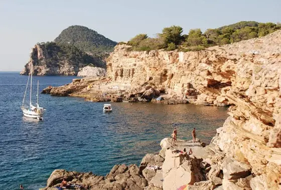 Punta galera Beach San Antonio Ibiza beach with holiday makers