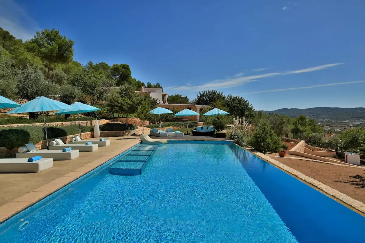 Can Frare Ibiza infinity pool with recliners and parasols
