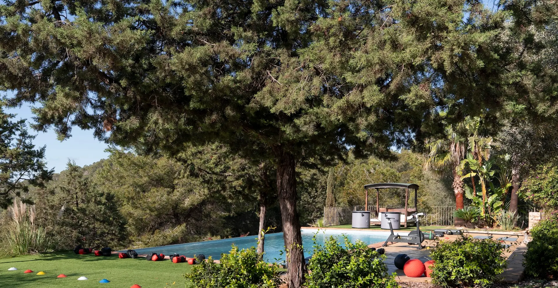 Luxury Villa Retreat in Ibiza Image set up with exercise equipment near the infinity pool